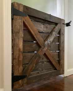 an open wooden door in the middle of a room