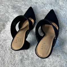 Black Suede Mules, Never Worn - No Tags But Comes With The Box! Chic Black Mules With Stacked Heel, Black Mules With 4-inch Block Heel, Chic Black Low Heel Heels, Chic Black Low Heel Mules, Black Pointed Toe Mules With Wrapped Heel, Black Mules With 4-inch Heel For Work, Trendy Black Mules With 4-inch Heel, Chic Black High Heel Mules, Black Mules With Branded Heel Counter For Night Out