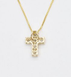 Real Diamond Cross Necklace set with Natural Diamonds, size 2 millimeters each, 0.18 Carats combined.Solid 14k Yellow Gold ☞ made to last.Click here for ☞ Solid Gold Collection**This is a Solid Gold pendant which comes with complimentary '18k Gold Vermeil' chain. For Solid Gold chains, please contact us.Diamond Details:• CERTIFIED Diamond• Weight: 0.18 Carats combined• Dimensions: 2mm each• Cut: RoundSolid Gold Details:• 0.7 grams of 14k Solid Yellow Gold• Dimensions: Length 12.5mm, Width 10mm• Lasts a lifetime - Perfect for everyday use (won’t tarnish)!*Final weight & dimensions depending on the chosen necklaceSKU HC-464 14k Gold Cross Pendant Jewelry For Wedding, Yellow Gold Cubic Zirconia Cross Pendant, Yellow Gold Cubic Zirconia Cross Jewelry, Hallmarked 14k Gold Jewelry In Diamond White, 14k Gold Diamond-cut Cross Pendant, 14k Gold Cross Pendant With Diamond Cut, 14k Gold Diamond Cut Cross Pendant Jewelry, 14k Gold Diamond Cut Cross Pendant, 14k Gold Cross Jewelry With 17 Jewels