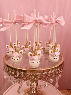 there are some cake pops with unicorn faces on them