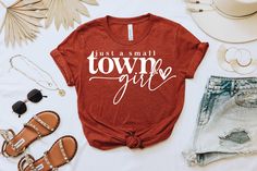 Just a small town girl shirt, country music shirt, country shirt, music lyrics shirt, song lyrics shirt, shirts with sayings, cowboy shirt by Mvsspear on Etsy Trendy Ring-spun Cotton T-shirt For Spring, Spring Text Print Tops In Ring-spun Cotton, Graphic Tee For Spring Country Concerts, Trendy Summer Tops For Country Concerts, Trendy Tops For Country Concerts In Spring, Trendy Tops For Spring Country Concerts, Spring Relaxed Fit Ring-spun Cotton Tops, Fall Letter Print T-shirt For Country Concerts, Relaxed Fit Tops For Spring