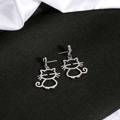 Material: Alloy Color: E3278-1 Style: Personality Silver Cat Design Dangle Earrings, Trendy Cat Design Jewelry For Party, Trendy Cat Design Jewelry For Parties, Trendy Silver Jewelry With Cat Design, Trendy Cat Ears Earrings As Gift, Trendy Cat Ears Earrings For Gift, Silver Cat Design Drop Earrings, Silver Drop Earrings With Cat Design, Gift Cat Design Earrings