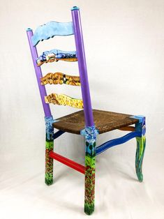 a wooden chair made to look like it has been painted