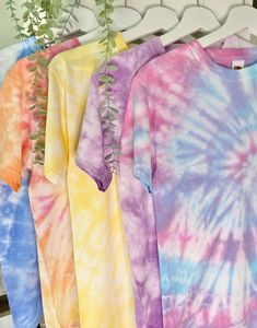 High Quality Handmade Unisex Tie-dye T-shirts - 100% Cotton! At Tie-dye by Rhi we have a wide variety of colours and sizes available, with each order being handmade to the highest quality. We can customise orders with multiple colours by clicking the 'Custom order' (£20.00) option and leaving your design requirements in the personalisation box. FREE standard delivery or upgrade to express delivery! With the quickest turn around possible we will get packaging your order as soon as payment has bee Tie Dye Crew Neck T-shirt, Tie-dye Cotton T-shirt For Spring, Spring Tie-dye Cotton T-shirt, Soft-washed Multicolor Tops For Summer, Soft-washed Multicolor Summer Tops, Bleached Tie-dye Crew Neck T-shirt, Multicolor Relaxed Fit Soft-washed T-shirt, Summer Rainbow Cotton T-shirt, Rainbow Cotton T-shirt For Summer