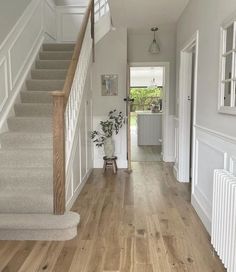 the hallway is clean and ready for us to use as an entrance way in this house