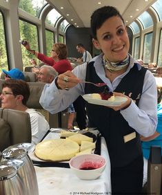 a woman holding a plate with food on it