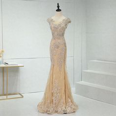 a dress on display in a white room