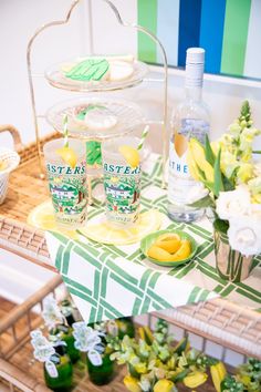 a table topped with lemons and bottles of gin