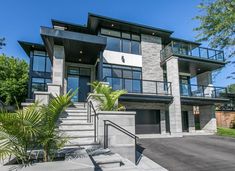 a large house with stairs leading up to it