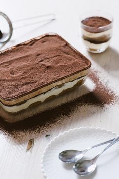 there is a dessert on the table with spoons