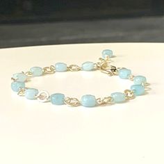 This beautiful aquamarine bracelet features all-natural aquamarine gemstones and made with all 925 hand-hammered Sterling Silver. Elegantly accented with a 925 Sterling silver hook lock. Also comes with a sterling silver extender chain for larger size adjustment.  Choose your wrist size for a more personalized fit.  GEMSTONE PROPERTIES: Aquamarine: Known as the March Birthstone. Aquamarine, the gemstone of tranquility and clarity, embodies the calming essence of the sea. Its serene blue hues evo Aquamarine Natural Stone Bracelets For Gifts, Aquamarine Gemstone Beads Bracelet As Gift, Aquamarine Gemstone Beads Bracelets As Gift, Everyday Blue Amazonite Bracelets, Adjustable Aquamarine Beaded Bracelets, Aquamarine Gemstone Beads Bracelet In Turquoise, Turquoise Aquamarine Bracelet With Gemstone Beads, Aquamarine Gemstone Beaded Bracelets, Turquoise Aquamarine Bracelets With Gemstone Beads