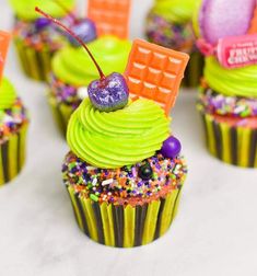 cupcakes with green frosting and candy decorations