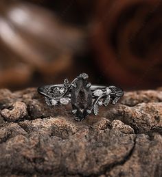 a close up of a ring on a rock