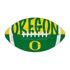 an oregon football painted on the side of a white wall with green and yellow stripes