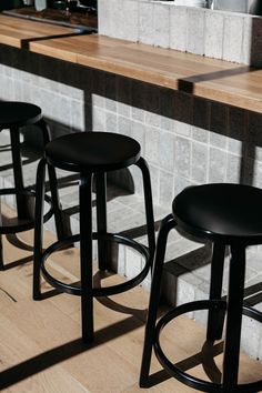 Photo by David Dworkind. Open Kitchen Interior, Stone Mansion, Restaurant Architecture, Sushi Bar, Stool Chair, Restaurant Interior Design, Wood Slats, Metal Lighting, Restaurant Interior