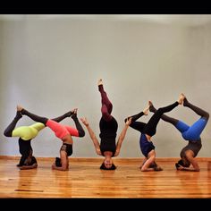 five people are doing yoga poses in a row on the floor with their hands together