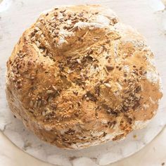 a loaf of bread sitting on top of a white plate