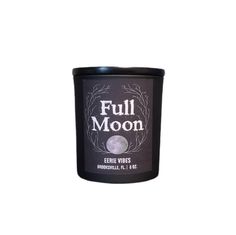 full moon candle in a black tin with white writing on the front and bottom corner