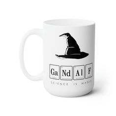 a white coffee mug with the words gad n'aife on it and a penguin