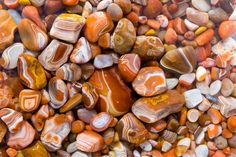 many different colored rocks are stacked together