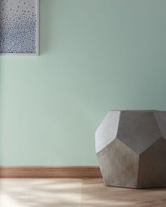 a vase sitting on top of a hard wood floor