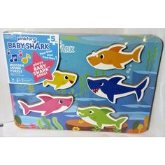 baby shark magnets in a box with water and sea animals on the bottom one