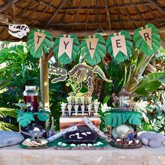 a table topped with lots of different types of food and decorations on top of it