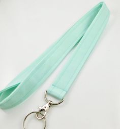 Solid Mint Green Lanyard for Keys and ID Badges available in 3 widths and also in a breakaway version.  🌼BRIGHTEN up your day and add a pop of personality with my collection of stylish and durable lanyards. Most lanyards available as a safety/breakaway, see link below. Great for students, teachers, nurses, or anyone on the go.  * Perfect gift for coworkers, family and friends. Made from soft, high quality 100%  cotton fabric. They provide a comfortable fit around your neck while securely holdin Nurse Lanyard, Lanyard For Keys, Lanyard Teacher, Nurse Office, Lip Balm Holder, Teacher Lanyard, Key Lanyard, Id Badge Holders, Key Fobs