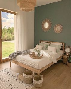 a bed room with a neatly made bed and two baskets on the floor next to it