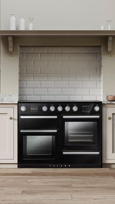 a black stove top oven sitting inside of a kitchen next to white cupboards and counter tops