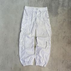 This is Nike Pants  Size XS  *if you need measurements feel free to ask* is in very good condition. Item is clean and ready to wear. Standart shipping: USA - 10 days Europe 7-14 days Canada - Australia - 12-22 business days Price will be more to Vintage Nike Hose, Nike Parachute Pants, Nike Hose, Cargo Track Pants, Baggy Cargo Pants, 90s Nike, Early Fall, Nike Pants, White Nikes