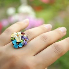 This romantic Glass ladybug flower ring is a perfect gift for women. It's very tender and unique! Set Matching bracelet: https://www.etsy.com/listing/161559547 Matching earrings: https://www.etsy.com/listing/200833152 Matching pendant: https://www.etsy.com/listing/161556072 Dimensions: the ring is adjustable. The bead is 2.2-2.4cm in diameter. Materials: artist lampwork bead, metal fittings. Colors used: blue, white, lilac, violet, green. Please, note, each bead is made by hand and may differ sl Floral Jewelry For Spring Weddings, Spring Wedding Flower Ring, Spring Flower Shaped Jewelry With 3d Flowers, Spring Flower Jewelry With 3d Flowers, Delicate Flower Ring For Spring Gift, Delicate Spring Flower Ring Gift, Flower Shaped Birthstone Ring, Adjustable Flower Shaped Gemstone Jewelry, Adjustable Flower Ring For Spring Wedding