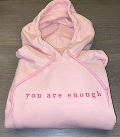 "\"you are enough\" embroidery on a hoodie or crewneck sweatshirt! Choose a color and size for your crewneck sweatshirt or hoodie!  Note: Embroidery will be pink thread on any color of sweatshirt! Please leave a note in the \"add personalization\" if you'd like a different thread color for the words :) thank you!!" Quote Sweatshirts, Note Embroidery, Gucci Makeup, Jeans Embroidery, Sweatshirt Embroidery, Pink Thread, Embroidery Shirt, Hoodie Aesthetic, Embroidery Hoodie