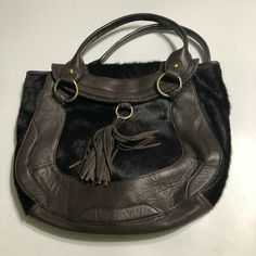 Kate Landry NWT Womens Brown Hand Bag Purse Tassel Haircalf $279 Condition: New With Tags Retail:  $279 Color: Brown, Black Size Hand Measured: Width 14.5" / Height 13" Tag: Tasseled Haircalf Luxury Brown Shoulder Bag With Tassels, Elegant Brown Shoulder Bag With Tassels, Elegant Brown Bags With Tassels, Luxury Travel Shoulder Bag With Tassels, Brown Hand, Tag Sale, Hand Bag, Bags Handbags, Tassels