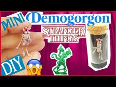 a person holding two tiny toy animals in their hands with the words mini demogorn on