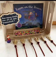 a room on the broom game with wooden sticks and candies in front of it