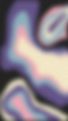 a blurry image of purple and blue swirls on a black background with white edges