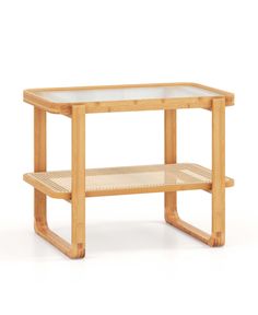 a wooden table with a glass top and two shelves on the bottom, against a white background