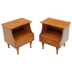 two small wooden nightstands sitting next to each other