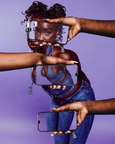 two women holding up their cell phones to take a selfie with the same person