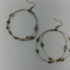 Nwt Tesori Bronze Whisper Wire Earrings Accented With Clear Gem Stones Nickel-free Metal Hoop Beaded Earrings, Wire Wrapped Round Metal Crystal Earrings, Wire Wrapped Metal Crystal Earrings, Wire Wrapped Round Crystal Earrings, Nickel-free Metal Beaded Earrings, Metal Round Wrap Earrings, Adjustable Wire Wrapped Crystal Earrings, Adjustable Metal Hoop Wrap Earrings, Adjustable Metal Hoop Earrings With Ear Wire