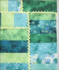 a piece of fabric with blue and green designs on it