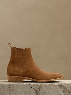 We stripped down the classic Western boot to focus on a streamlined silhouette that really shows off this rich, Italian suede.  Plus, we added a small surprise if you look closely: the toe of the boot is a rounded, almond shape, set to contrast with a squared toe created by its Italian leather soles for sculptural effect.  Leather uppers, lining and soles.  Foam footbed for comfort.  Made in Portugal.  Whole and half sizes. Fitted Brown Chelsea Boots With Suede Lining, Chelsea Boots With Reinforced Heel And Almond Toe, Fitted Chelsea Boots With Reinforced Almond Toe, Fitted Chelsea Boots With Reinforced Heel And Almond Toe, Fitted Suede Boots With Round Toe, Suede Chelsea Boots With Round Toe, Fitted Suede Chelsea Boots With Round Toe, Classic Chelsea Boots With Suede Lining For Fall, Classic Suede Chelsea Boots For Fall