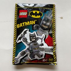 a lego batman action figure in its package