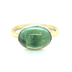 This one-of-a-kind Oval Cabochon Tourmaline Ring in 18KY is the perfect addition to compliment any ensemble. 18k yellow gold Green Tourmaline Cabochon Size 7 Designed and handcrafted in New Orleans Please note that due to the natural variations that can be found in gemstones, each stone's color may vary slightly from the images pictured. Please Note: All our pieces are handmade and unique. Color might vary from picture and piece to piece. Luxury Men's Oval Cabochon Engagement Ring, Yellow Gold Moonstone Ring With Polished Oval Cabochon, Yellow Gold Moonstone Ring With Oval Cabochon, Gold Oval Dome Ring With Cabochon, Yellow Gold Emerald Ring With Oval Cabochon Bezel Setting, Yellow Gold Emerald Ring With Bezel Setting, Oval Emerald Ring With Polished Finish In Yellow Gold, Oval Yellow Gold Emerald Ring With Polished Finish, Oval Emerald Ring In Yellow Gold With Polished Finish