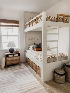 a bedroom with bunk beds and baskets on the floor