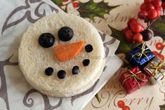 a snowman cookie sitting on top of a napkin