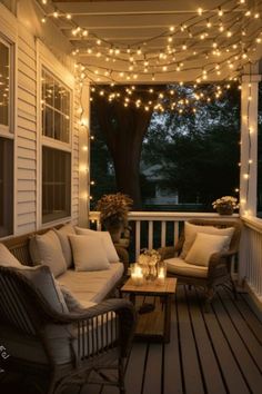 a porch covered in string lights and wicker furniture