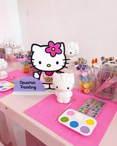 a hello kitty themed birthday party on a table