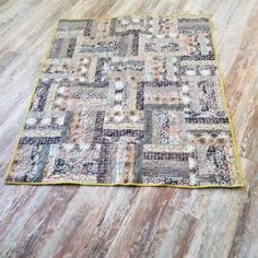 an old patchwork quilt on the floor